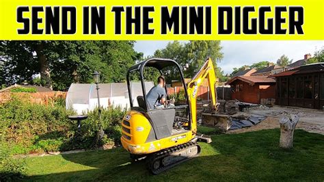 how to get a mini digger over a wall|mini digger into garden.